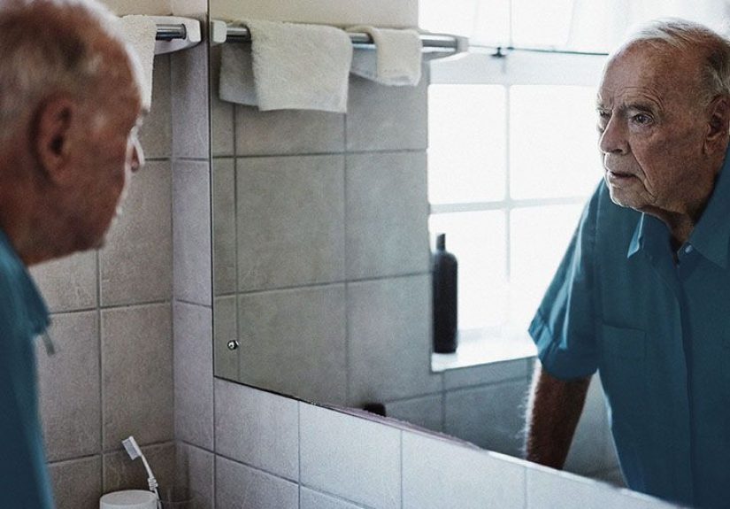 What is mask face, and why does it occur with Parkinson's disease?