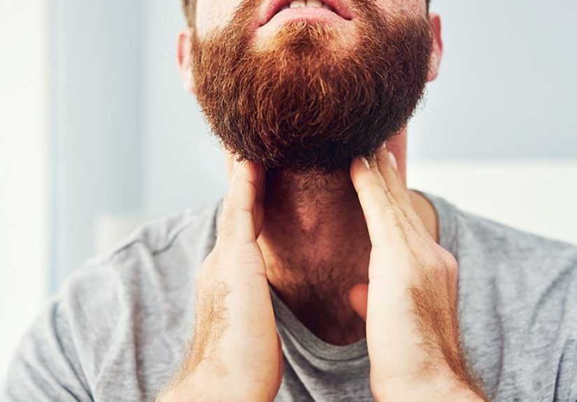 What causes a sore throat and swollen glands?